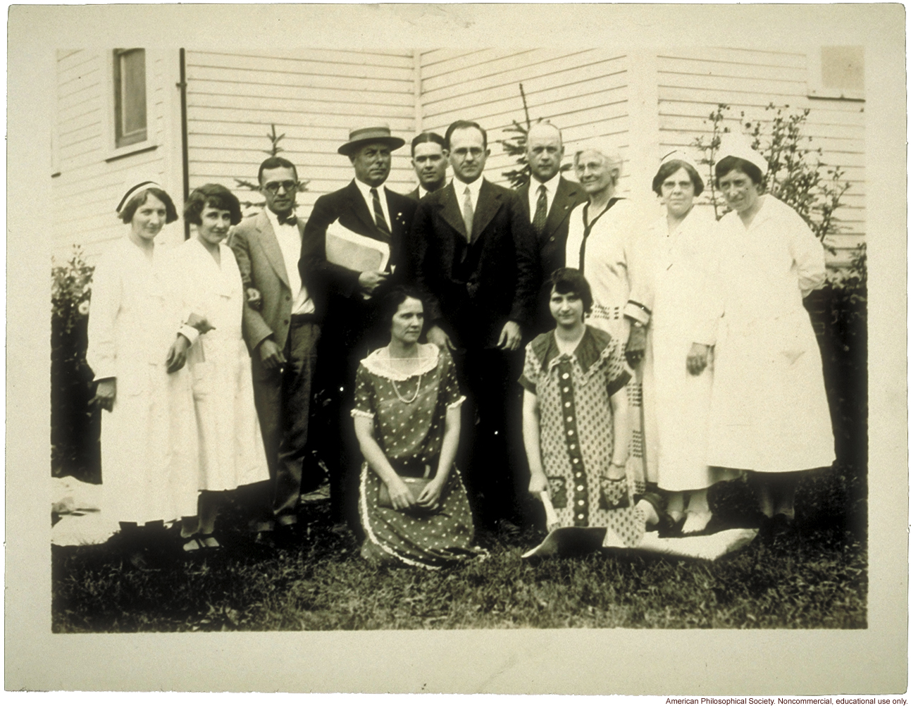 Examining staff for the Fitter Families Contest at Michigan State Fair. Leon F. Whitney (center) and Mary T. Watts (standing, third from right).