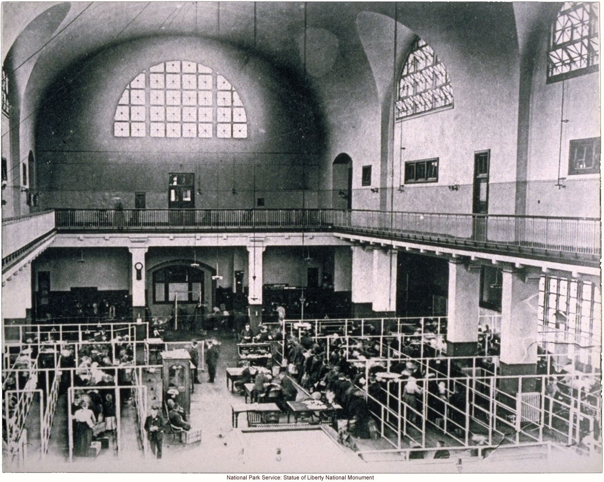 Immigrants being processed in the Great Hall at Ellis Island