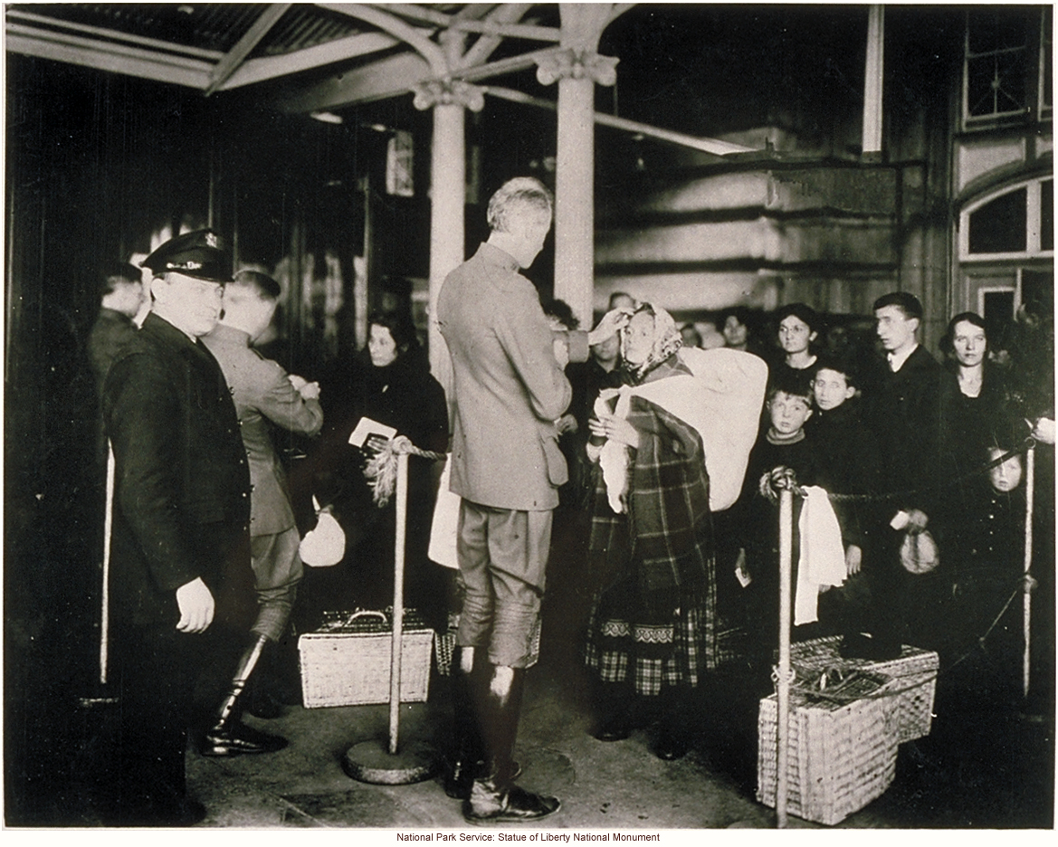 Doctor examining alien immigrants at Ellis Island