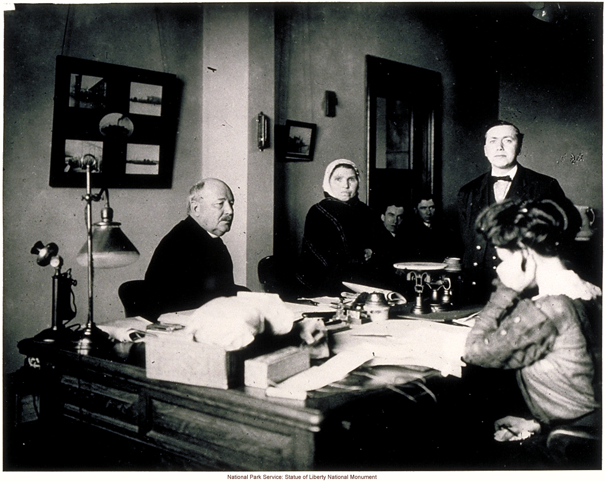 Immigration examiner Augustus Sherman (right), who did photographic studies of immigrants in native dress, with Ellis Island Superintendent