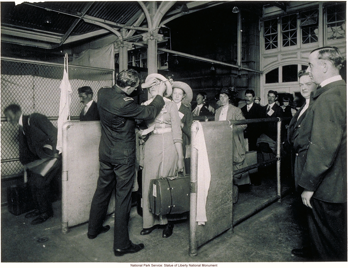 Doctor examining eyes of immigrant woman at Ellis Island