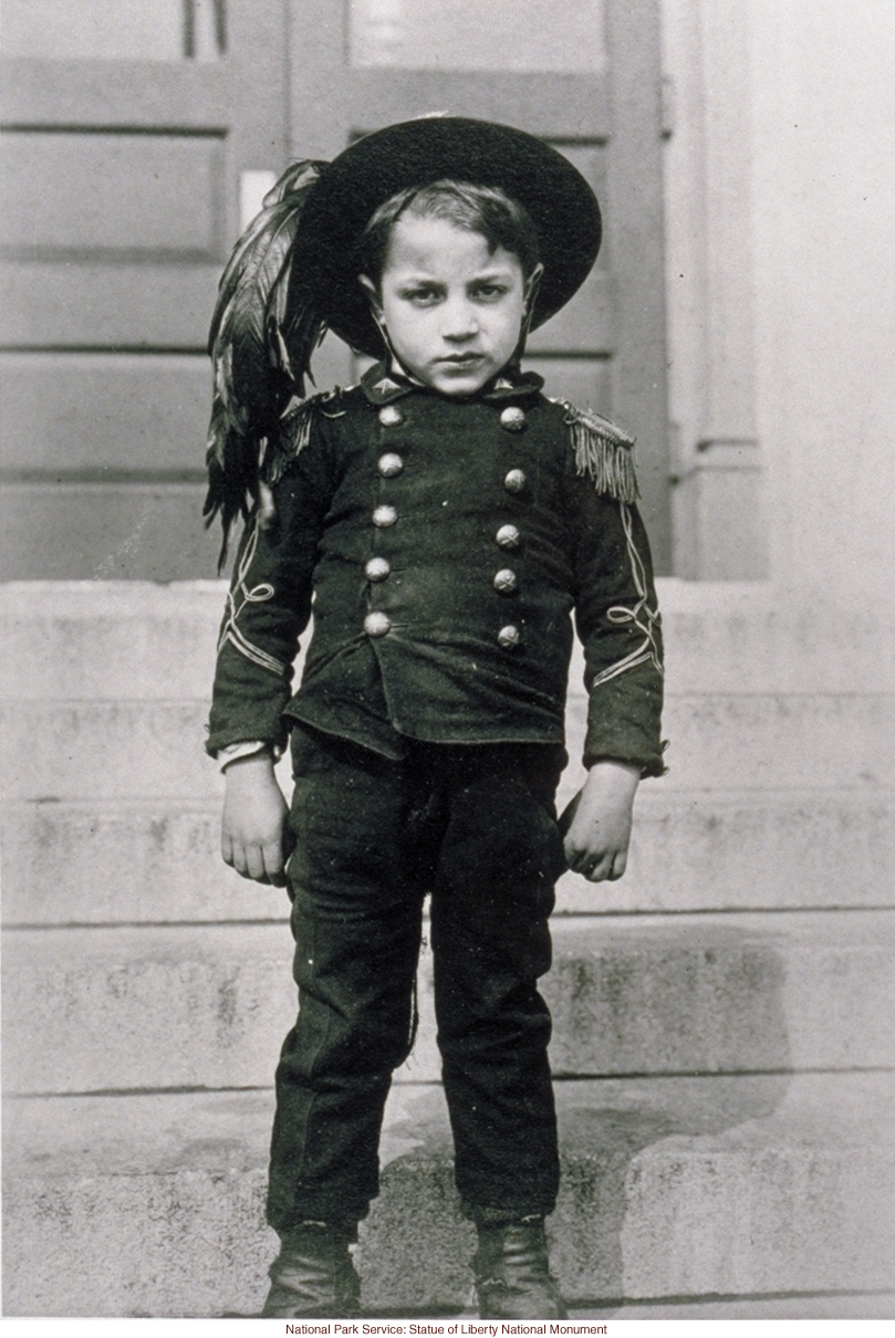 Italian boy at Ellis Island (Photograph by Augustus Sherman)