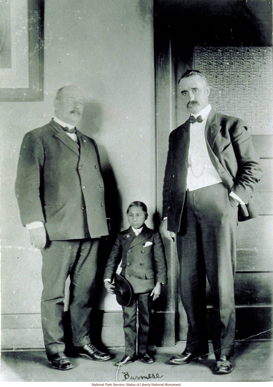 Burmese dwarf at Ellis Island (Photograph by Augustus Sherman)