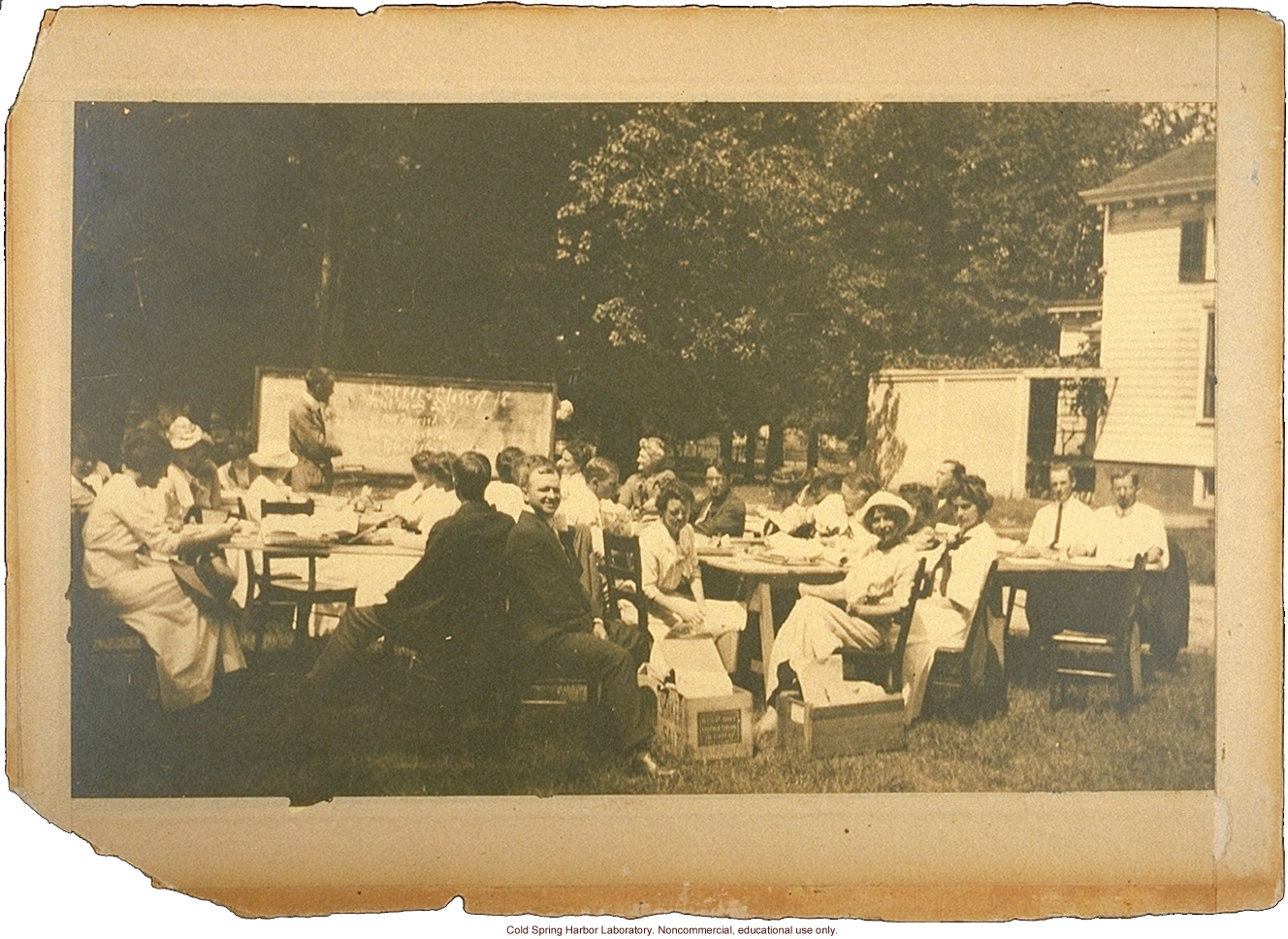Eugenics Record Office, Field Worker Training Class of 1913 (Laughlin in foreground, center, Davenport at blackboard, Stewart House in background)