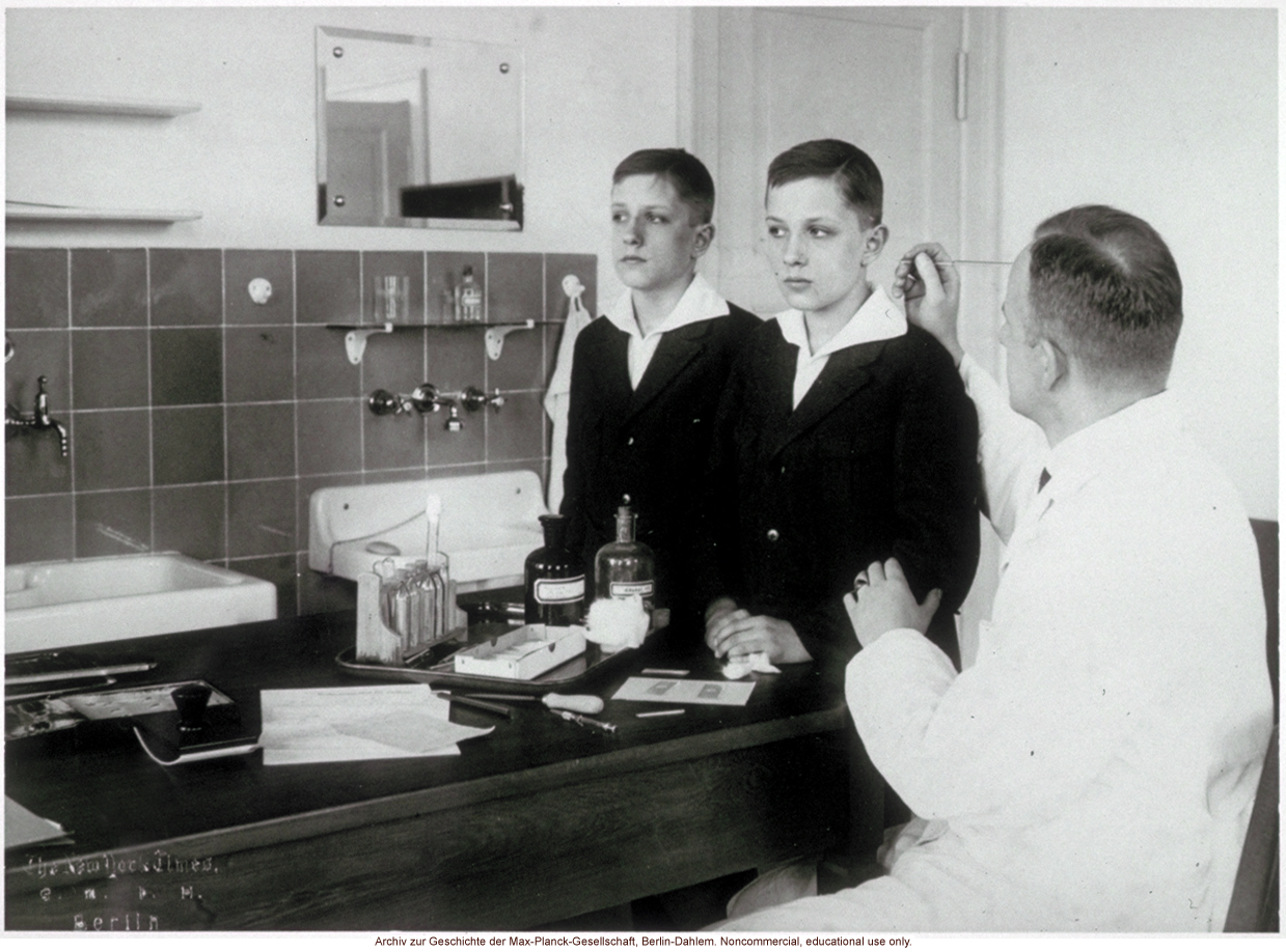 12-year-old male twins undergoing anthropometric study by Otmar Freiherr von Verschuer