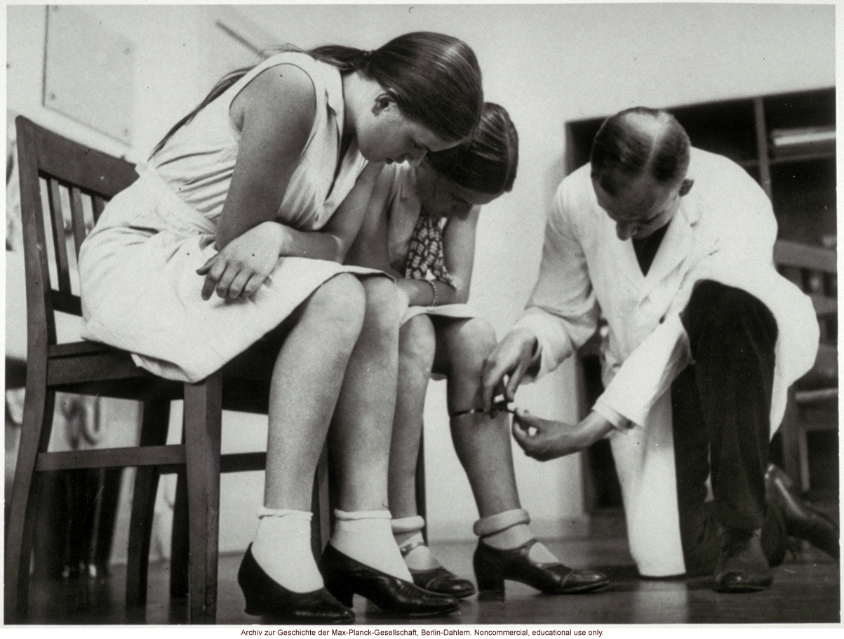 16-year-old female twins undergoing anthropometric study by Otmar Freiherr von Verschuer