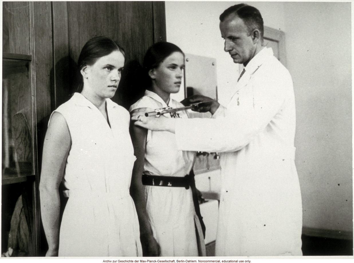 16-year-old female twins undergoing anthropometric study by Otmar Freiherr von Verschuer