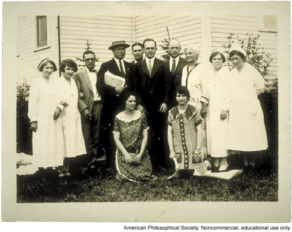 Examining staff for the Fitter Families Contest at Michigan State Fair. Leon F. Whitney (center) and Mary T. Watts (standing, third from right).