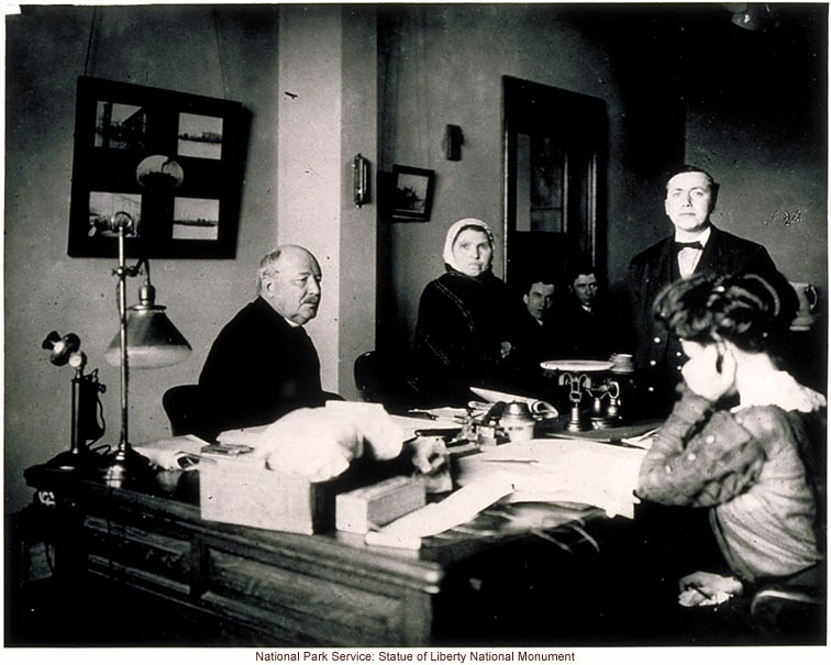 Immigration examiner Augustus Sherman (right), who did photographic studies of immigrants in native dress, with Ellis Island Superintendent