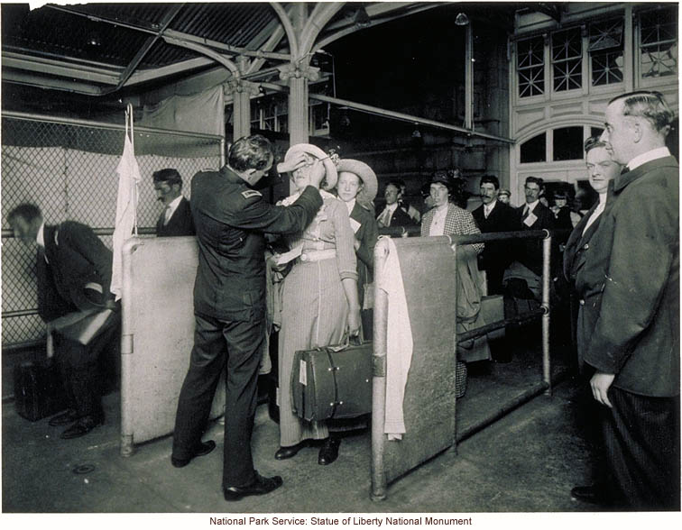 Doctor examining eyes of immigrant woman at Ellis Island
