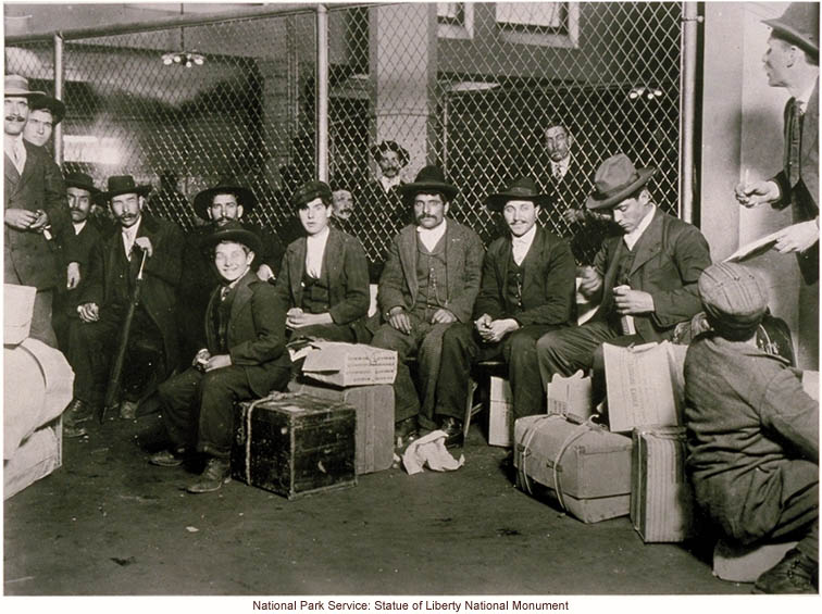 Group of Italian immigrant men with suitcases