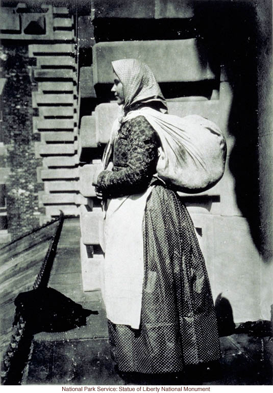 European immigrant at Ellis Island (Photograph by Augustus Sherman)