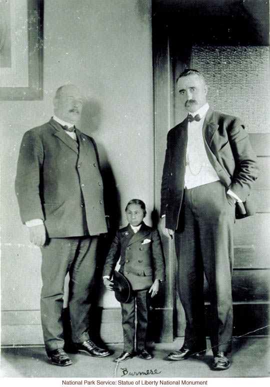 Burmese dwarf at Ellis Island (Photograph by Augustus Sherman)