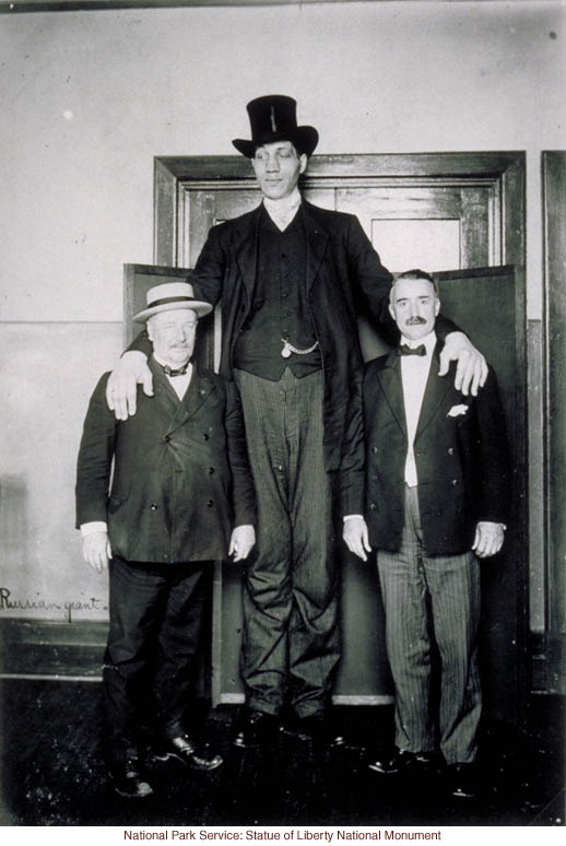 Russian giant at Ellis Island (Photograph by Augustus Sherman)