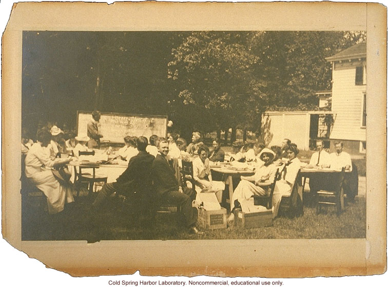 Eugenics Record Office, Field Worker Training Class of 1913 (Laughlin in foreground, center, Davenport at blackboard, Stewart House in background)