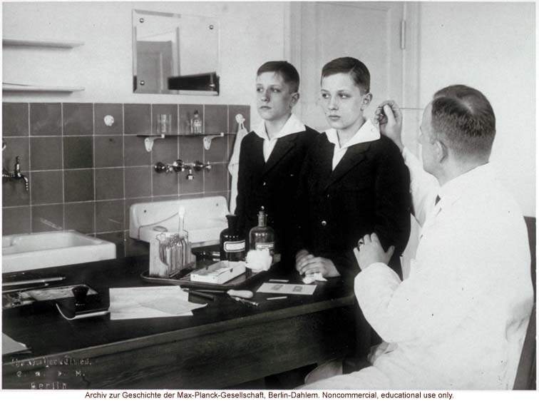 12-year-old male twins undergoing anthropometric study by Otmar Freiherr von Verschuer