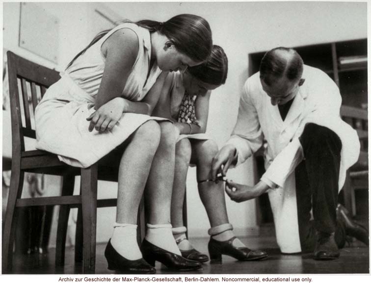 16-year-old female twins undergoing anthropometric study by Otmar Freiherr von Verschuer