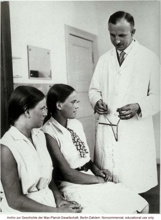 16-year-old female twins undergoing anthropometric study by Otmar Freiherr von Verschuer