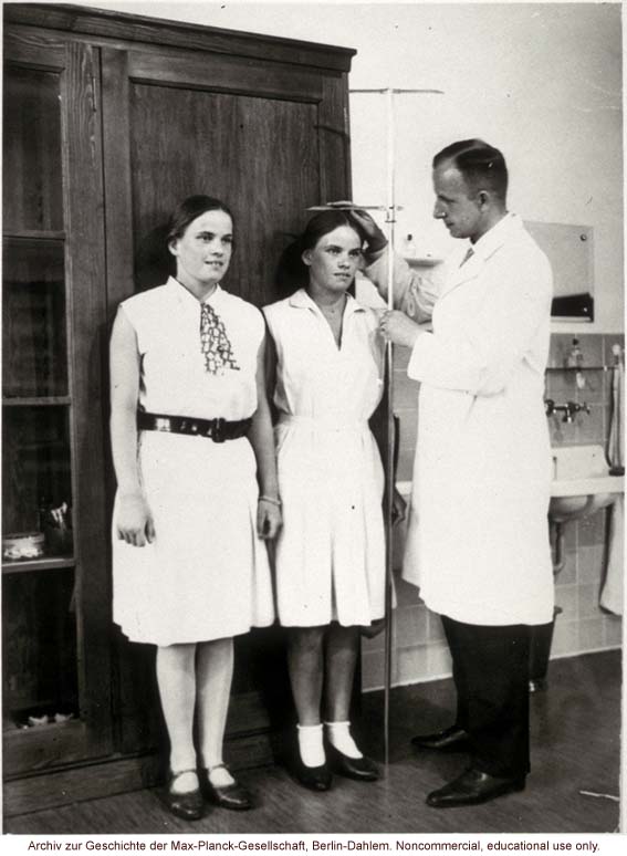 16-year-old female twins undergoing anthropometric study by Otmar Freiherr von Verschuer